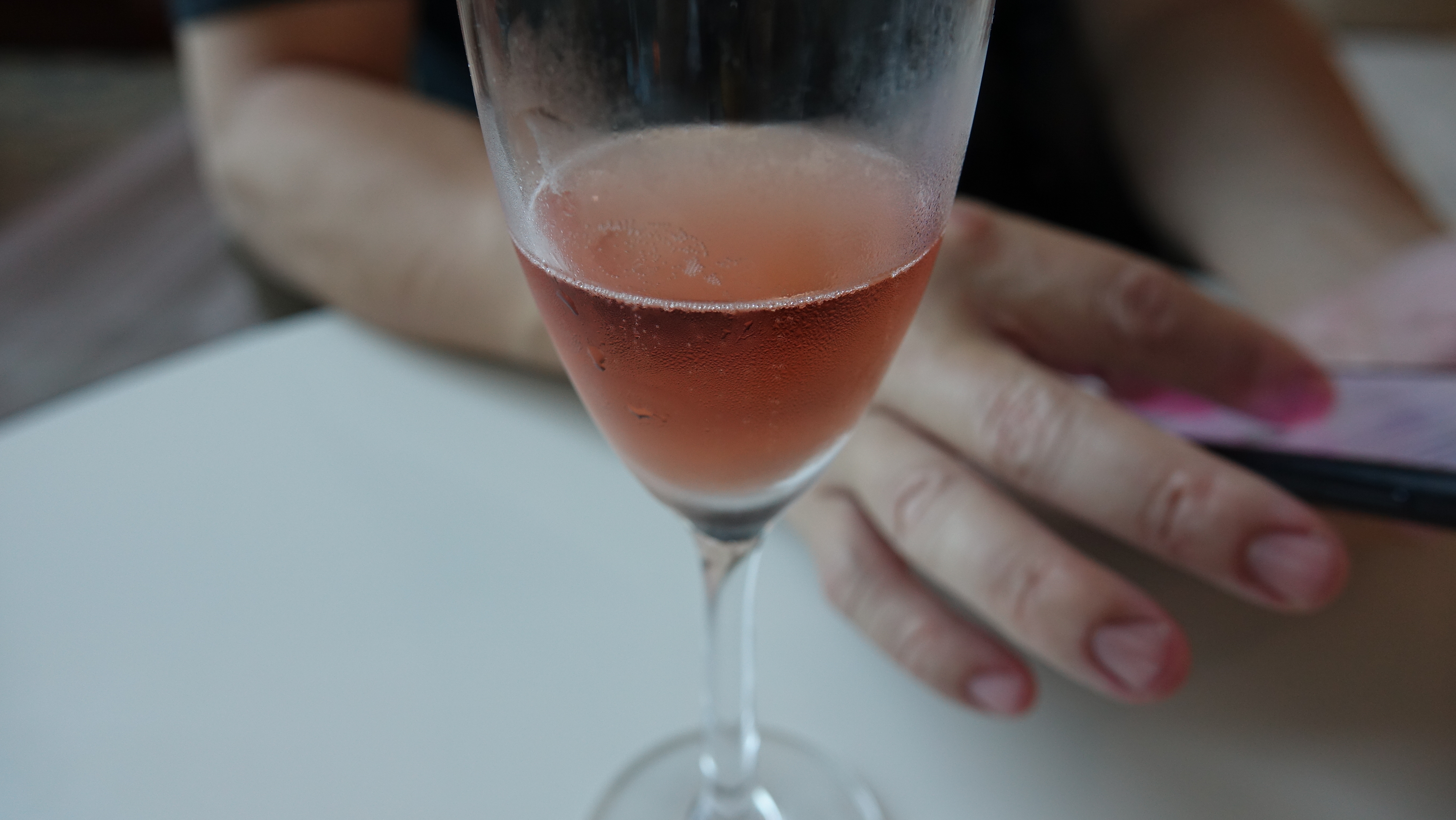 a glass of pink liquid