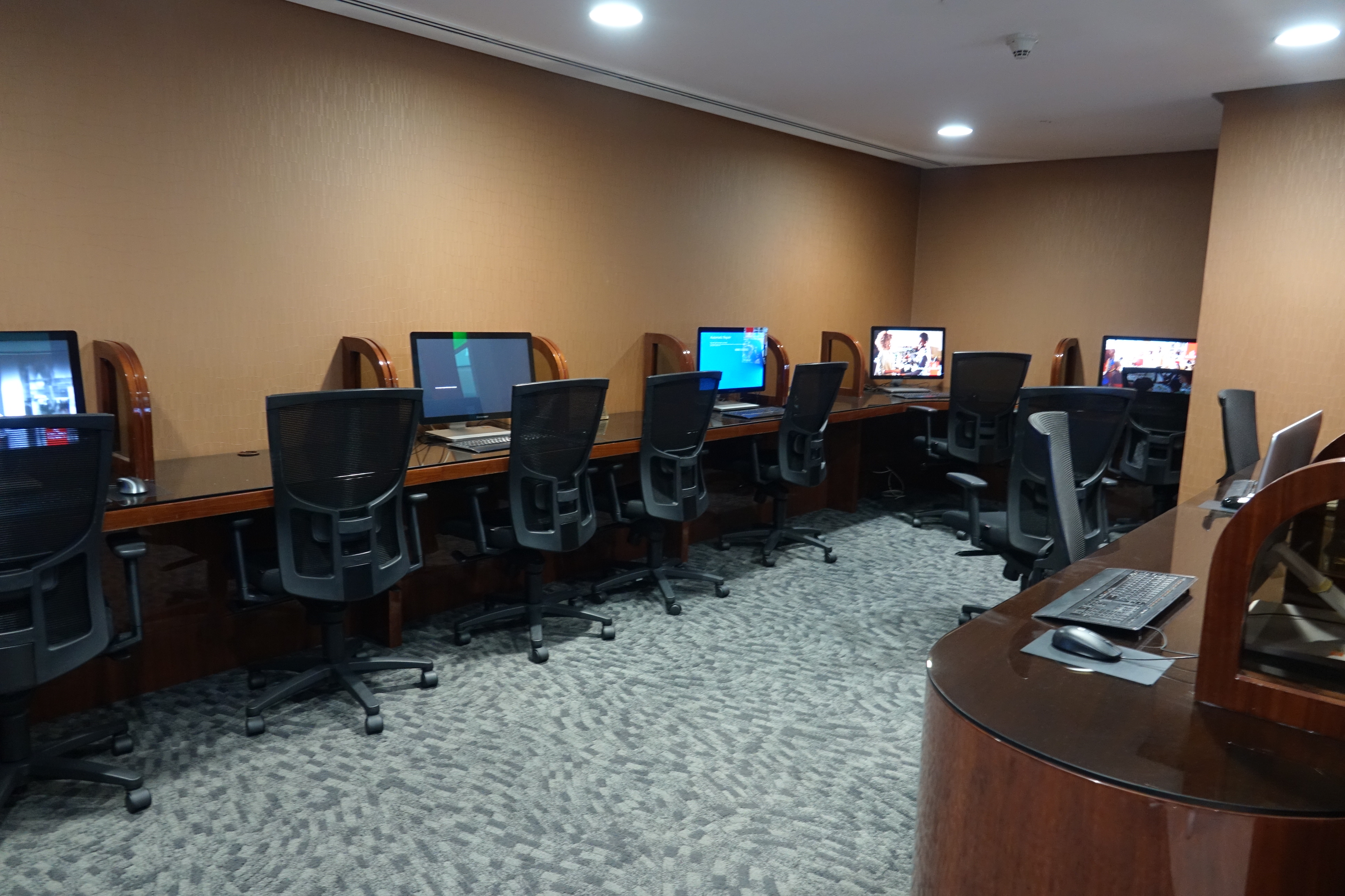 a room with computers and chairs