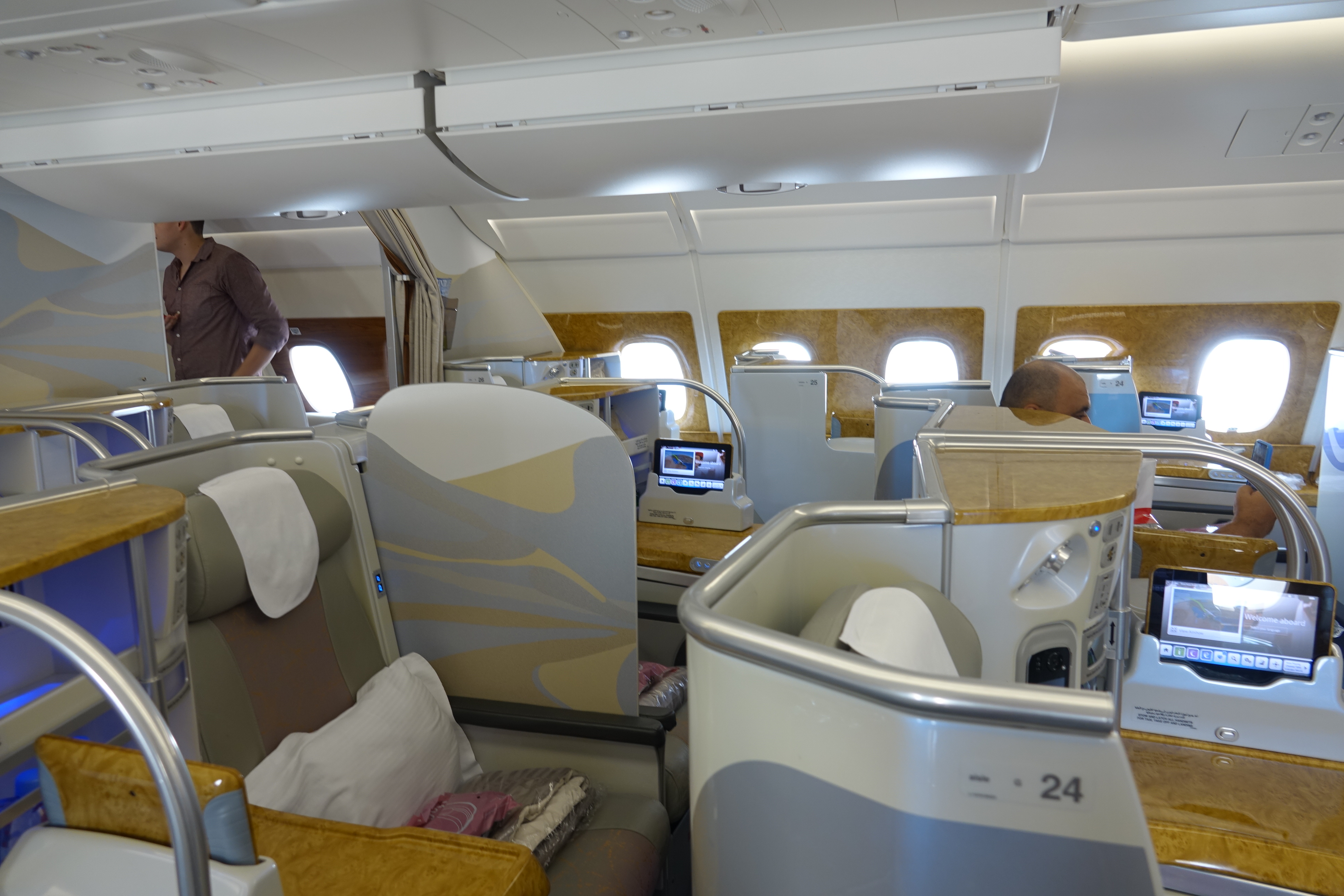 a man standing in a chair in an airplane