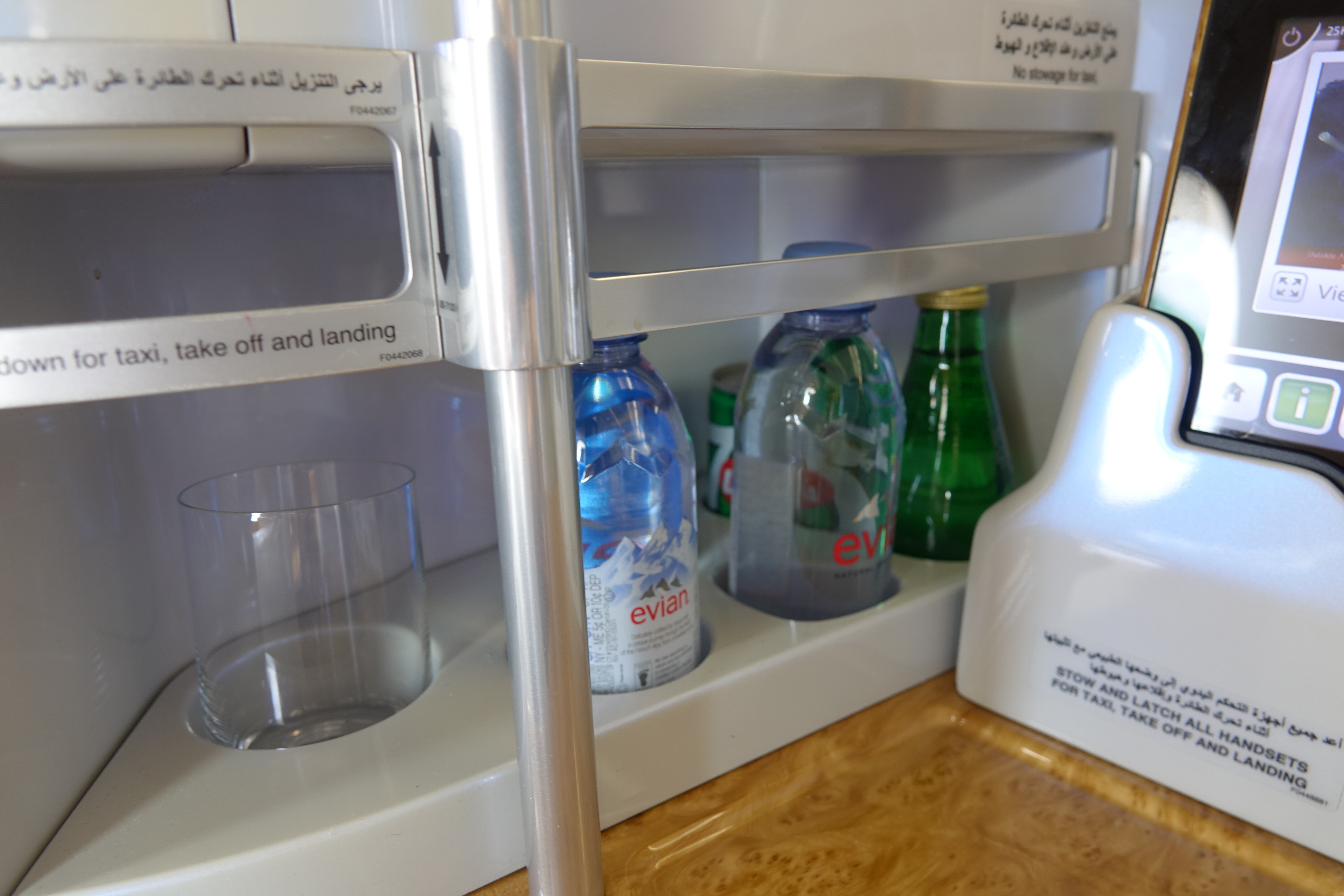 a shelf with bottles and glass on it