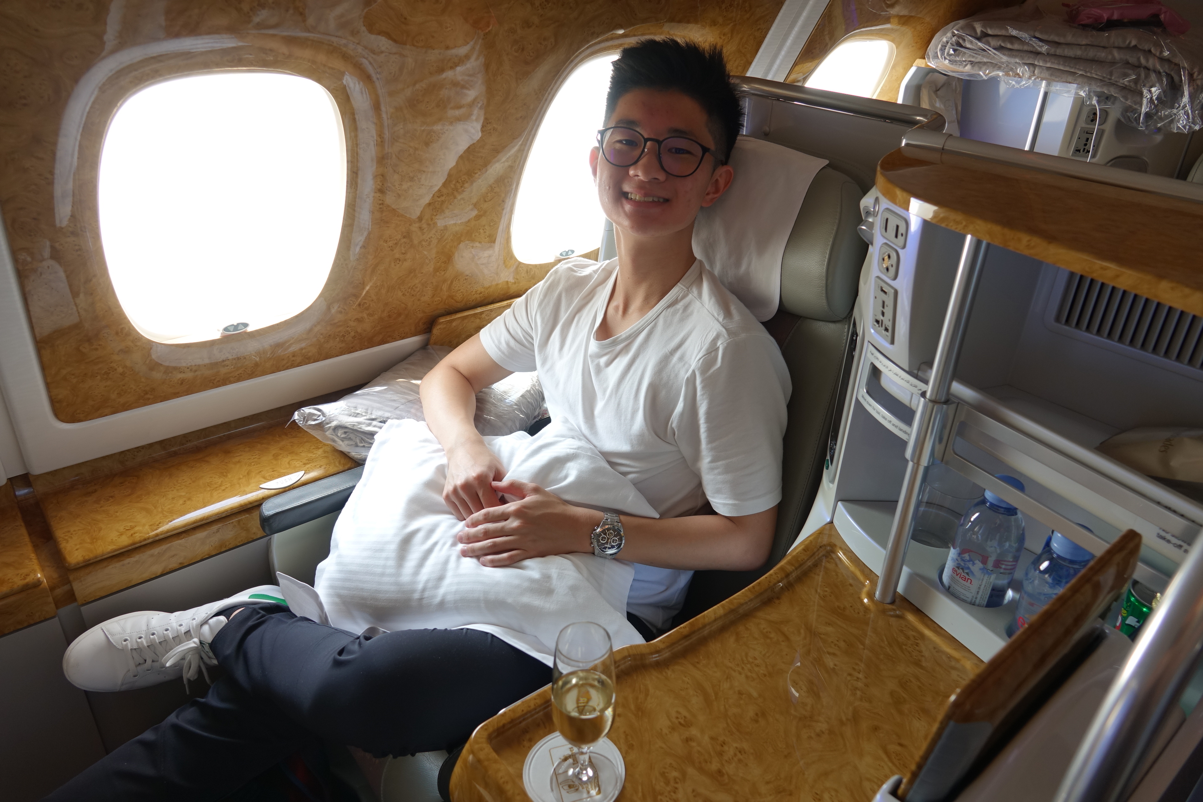 a man sitting in a chair in an airplane