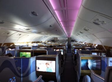 an airplane with seats and monitors