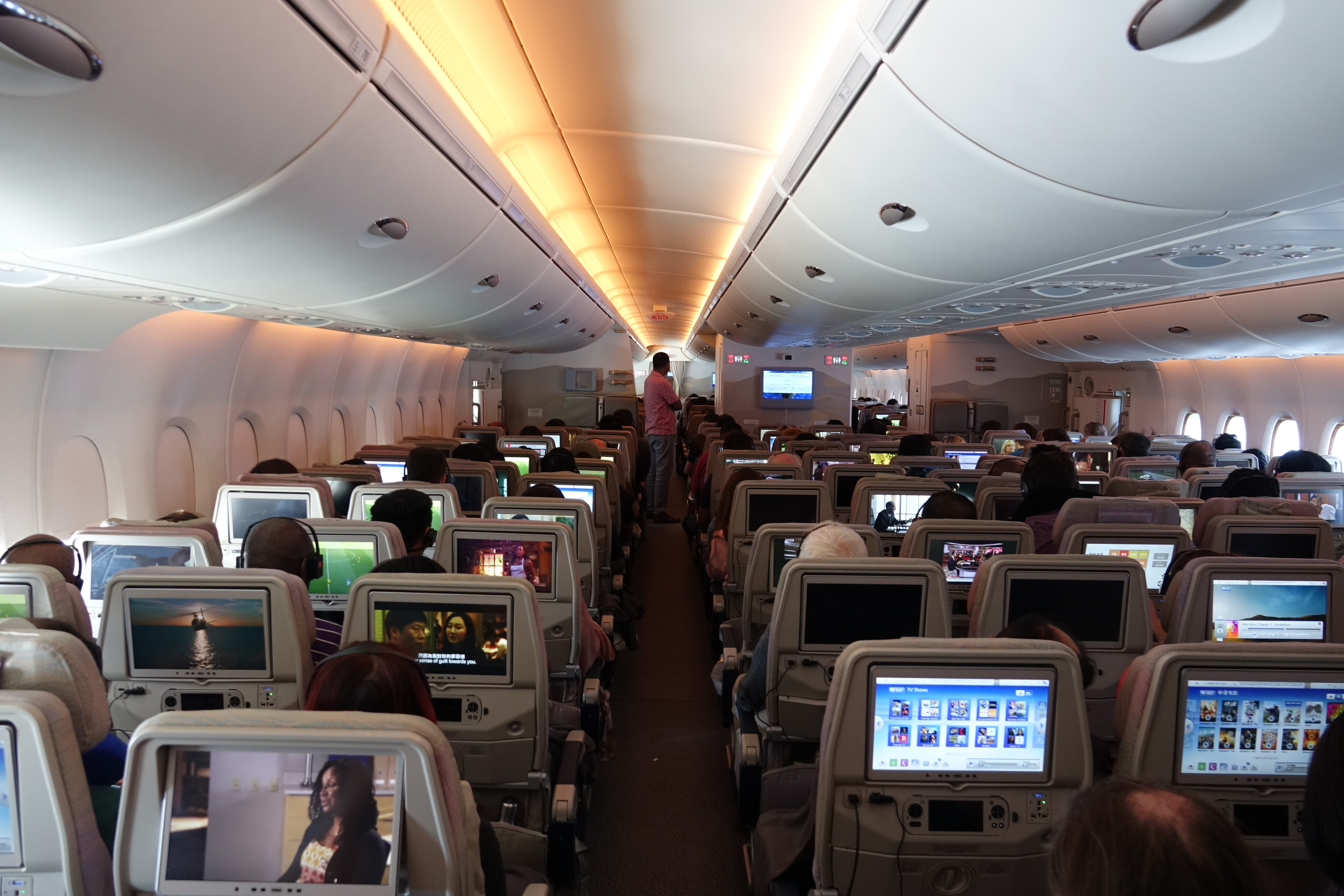 a group of people sitting in an airplane