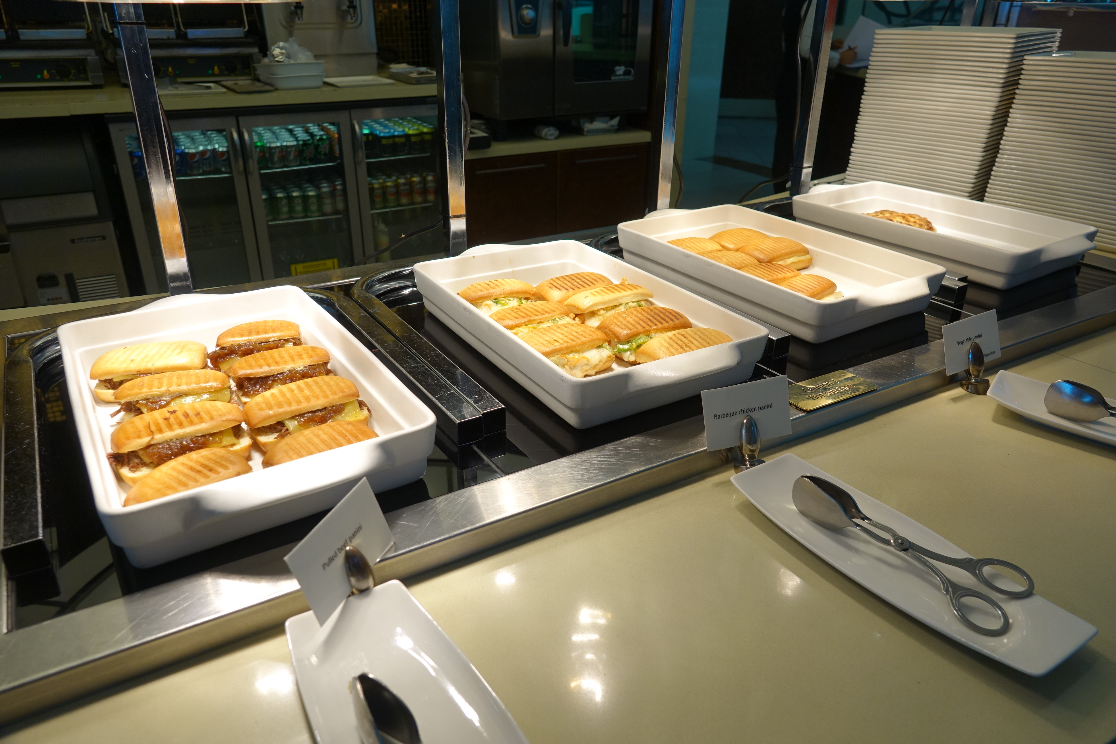 a trays of sandwiches on a counter