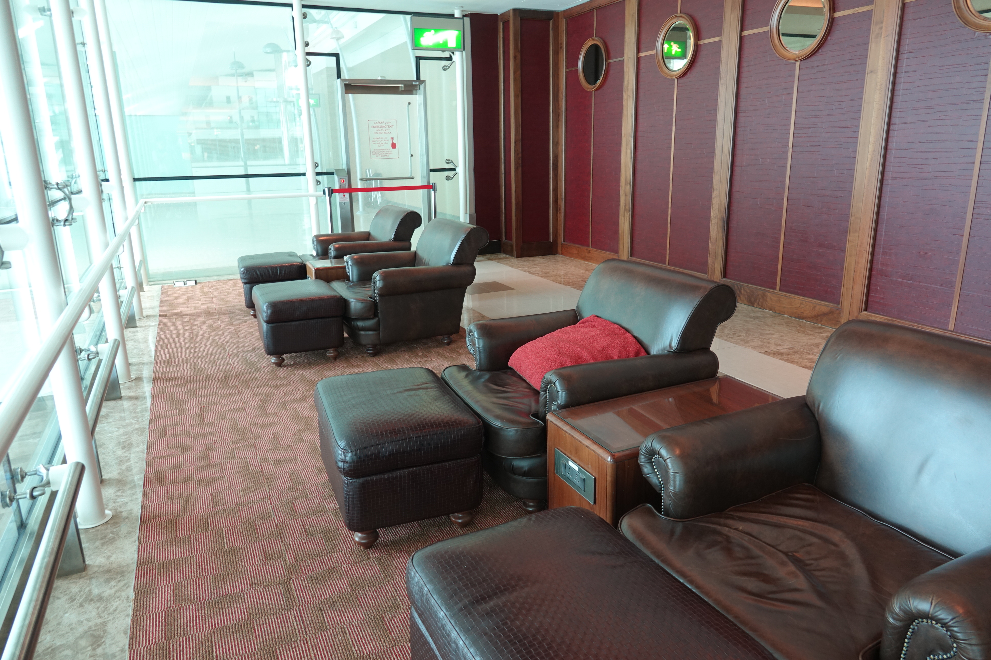 a room with leather chairs and tables