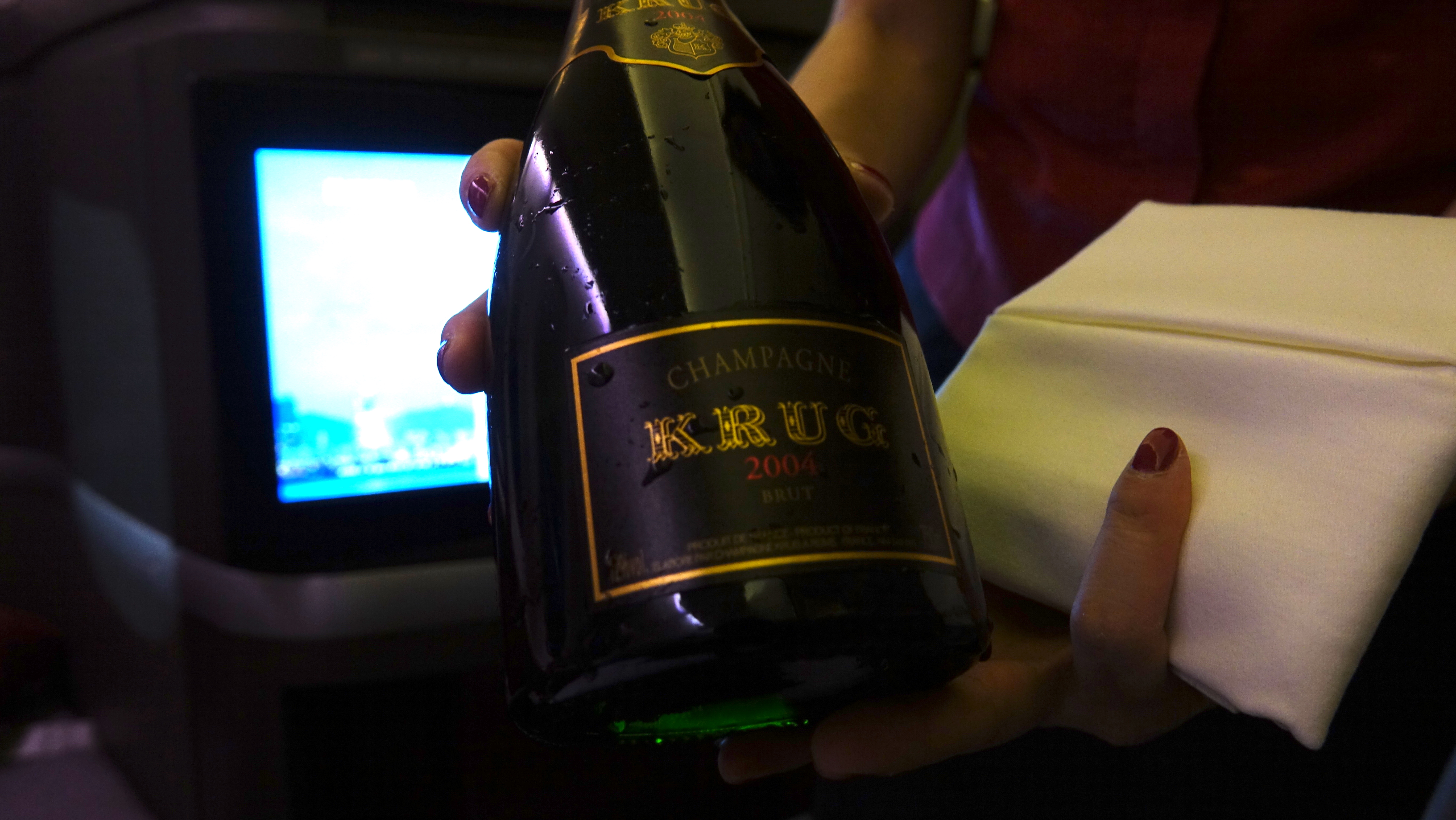 a person holding a bottle of champagne