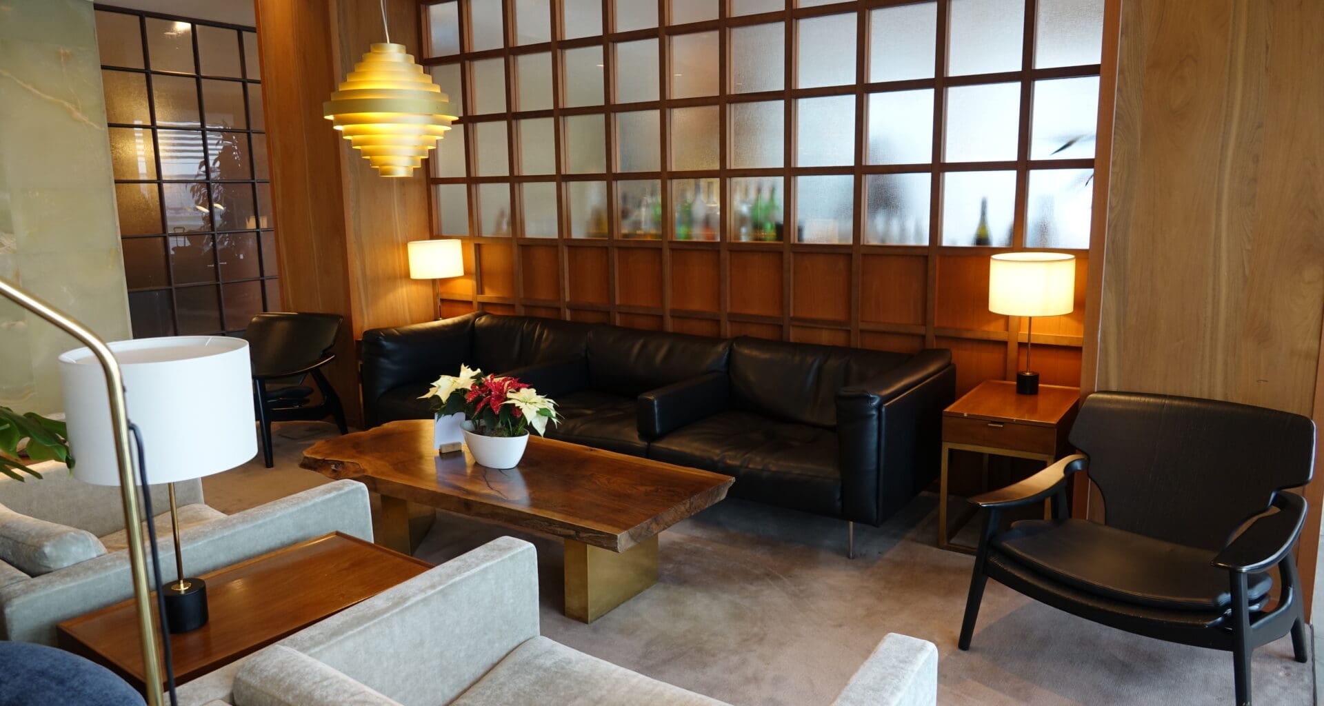 a room with a couch and chairs