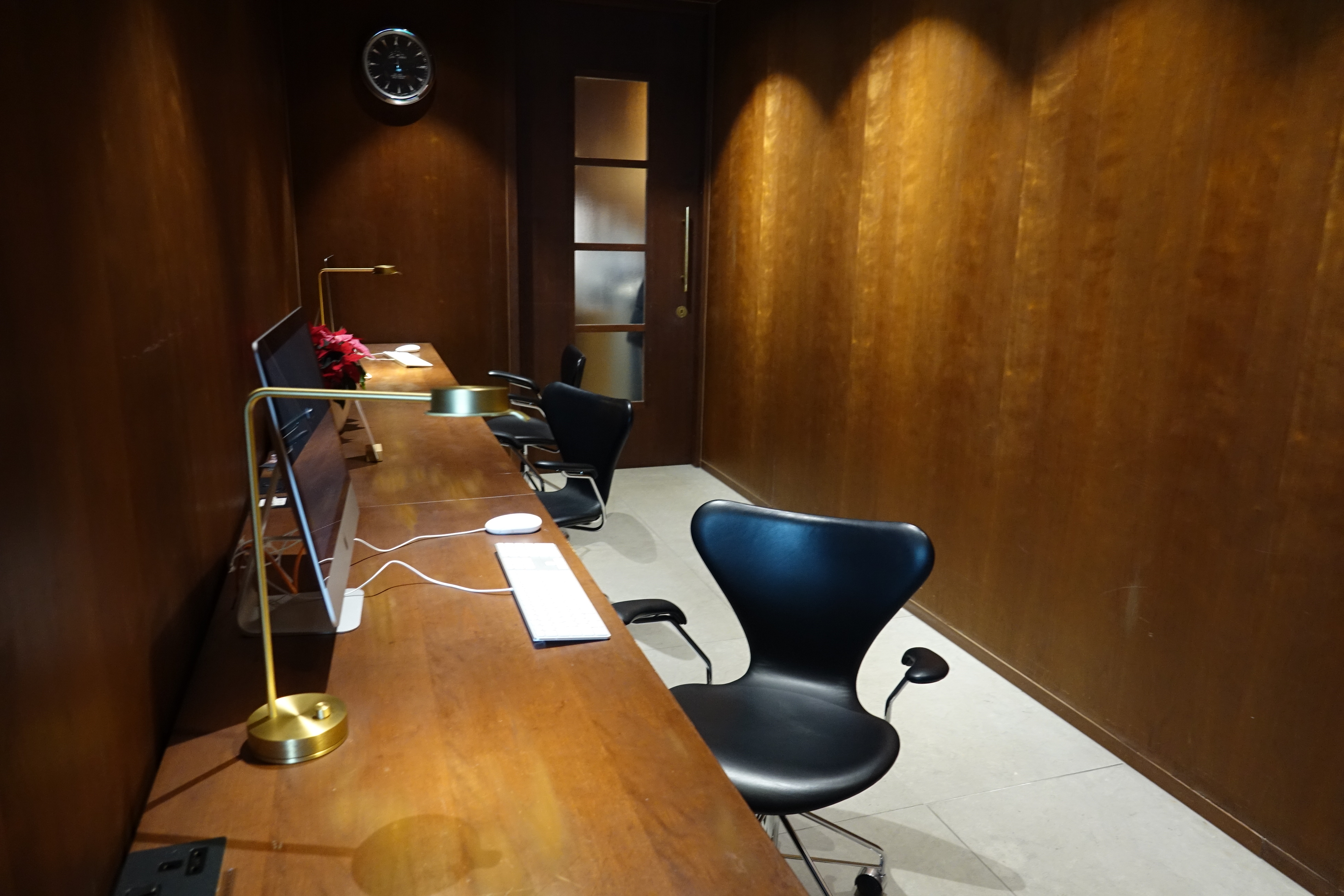 a desk with a computer and a chair