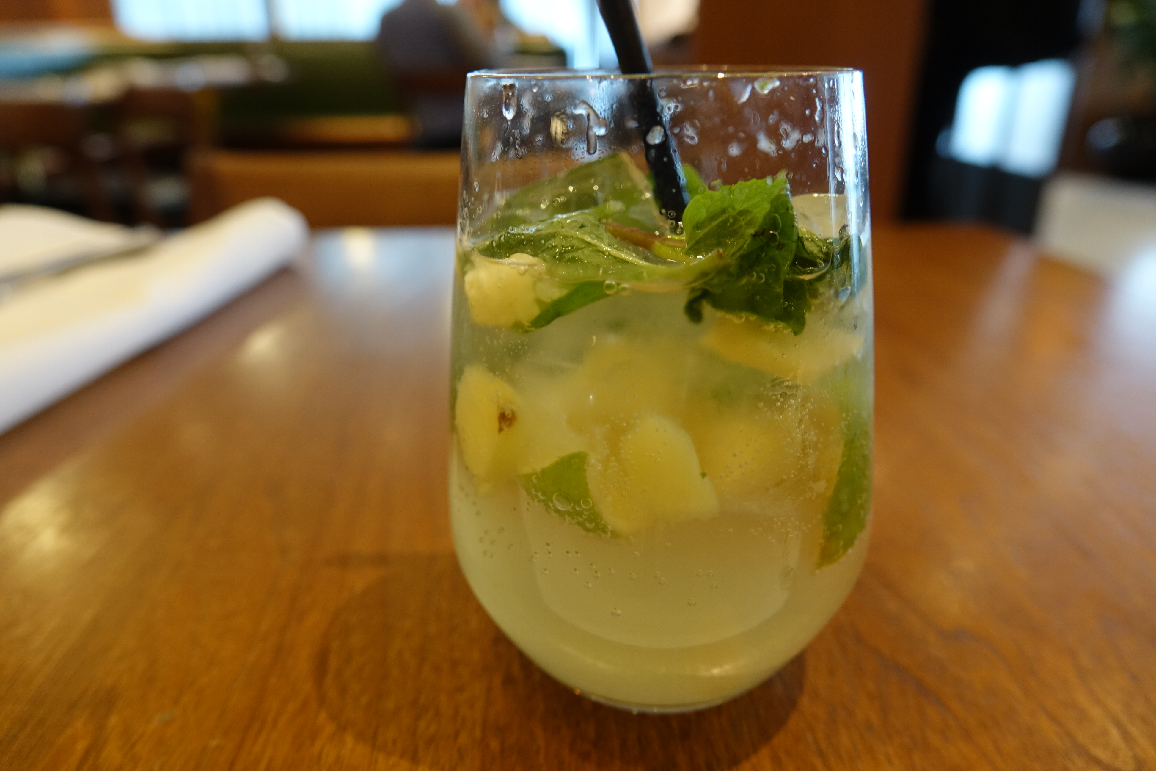 a glass with a drink and a straw