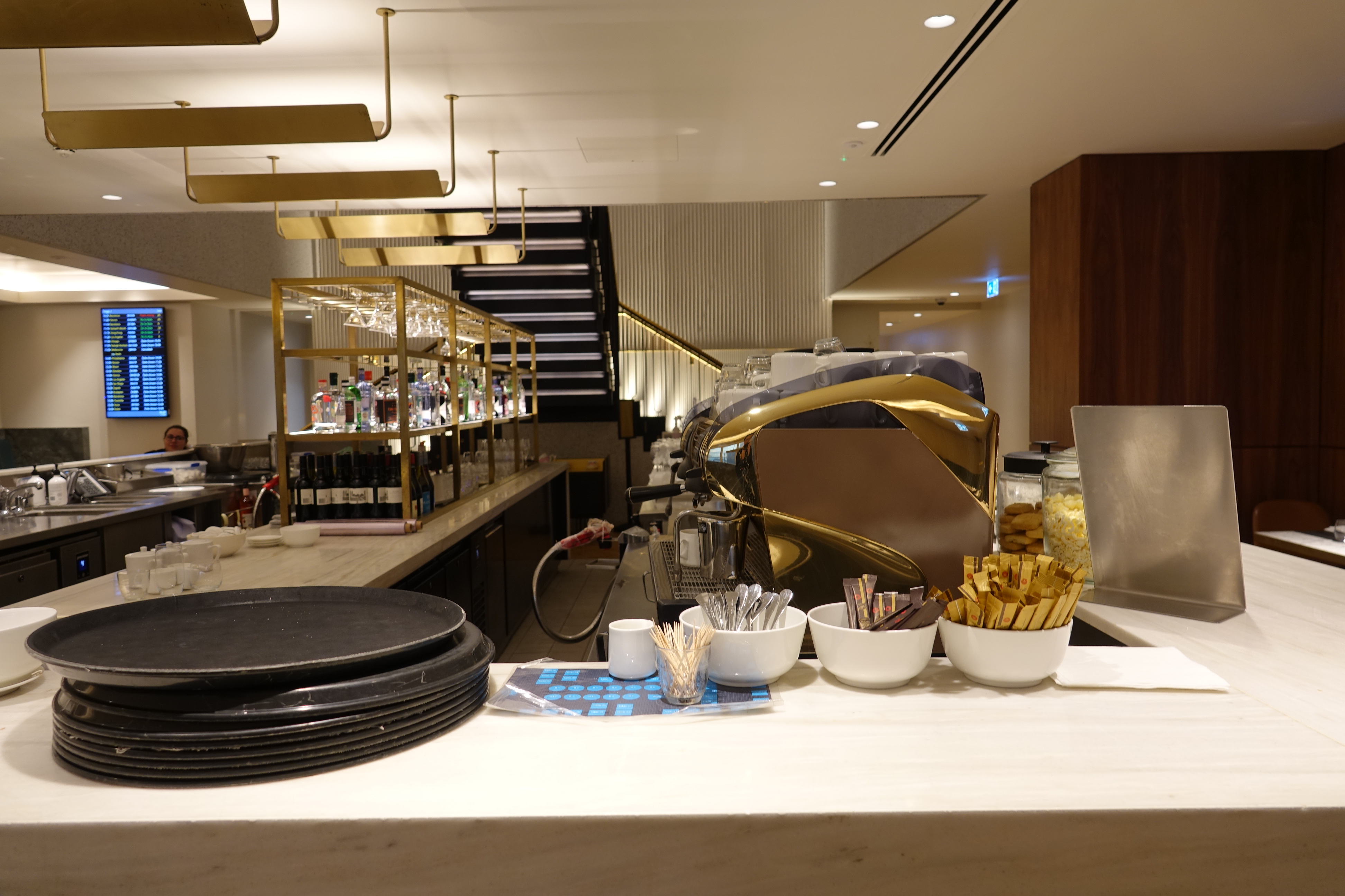 a counter with bowls of food and utensils