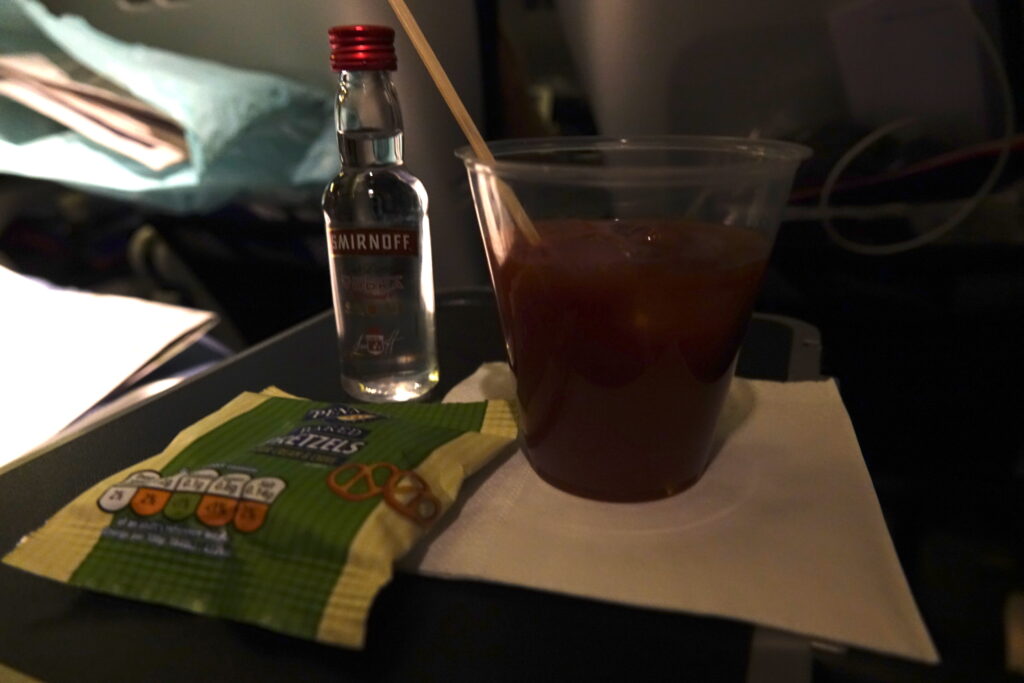 a drink and a bottle on a table