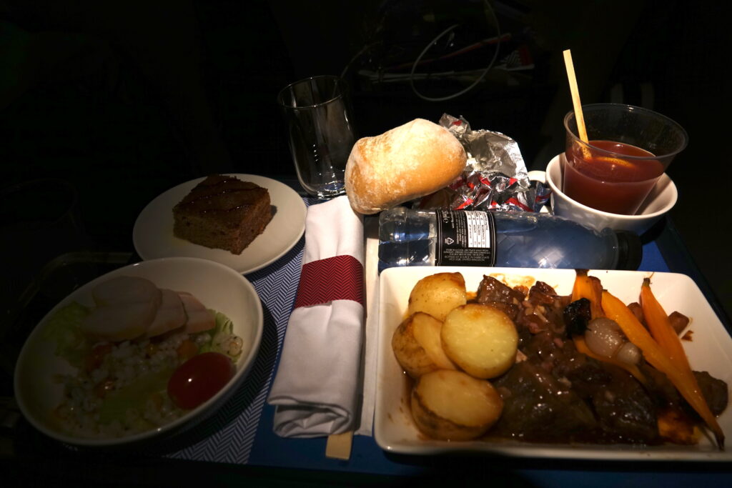 a table with plates of food and drinks