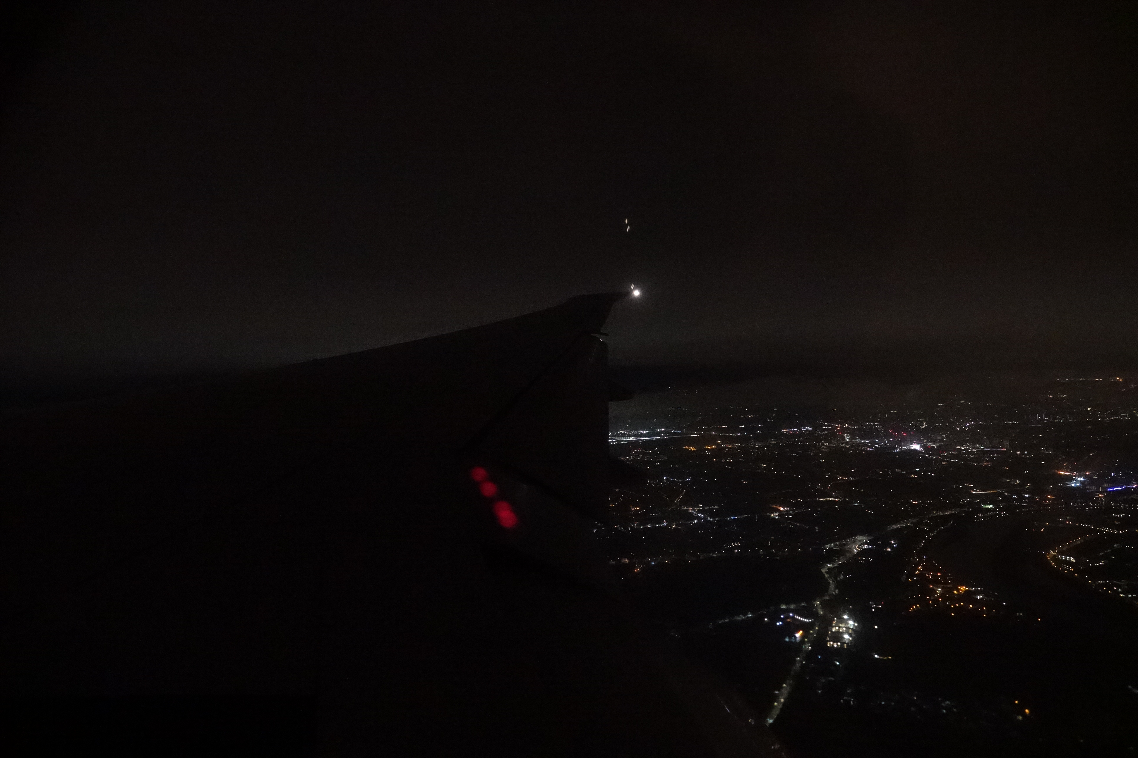 an airplane wing at night