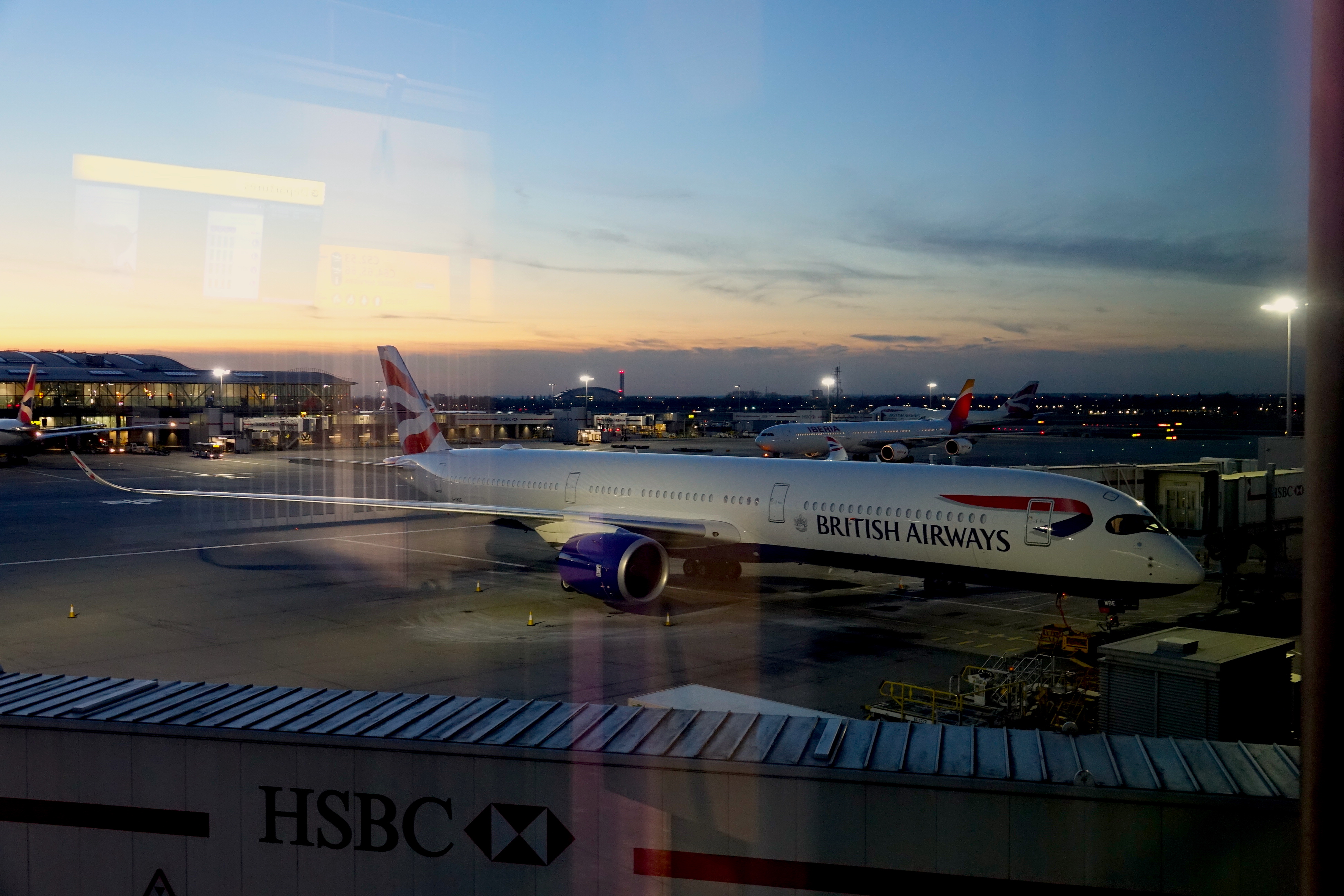 a group of airplanes at an airport