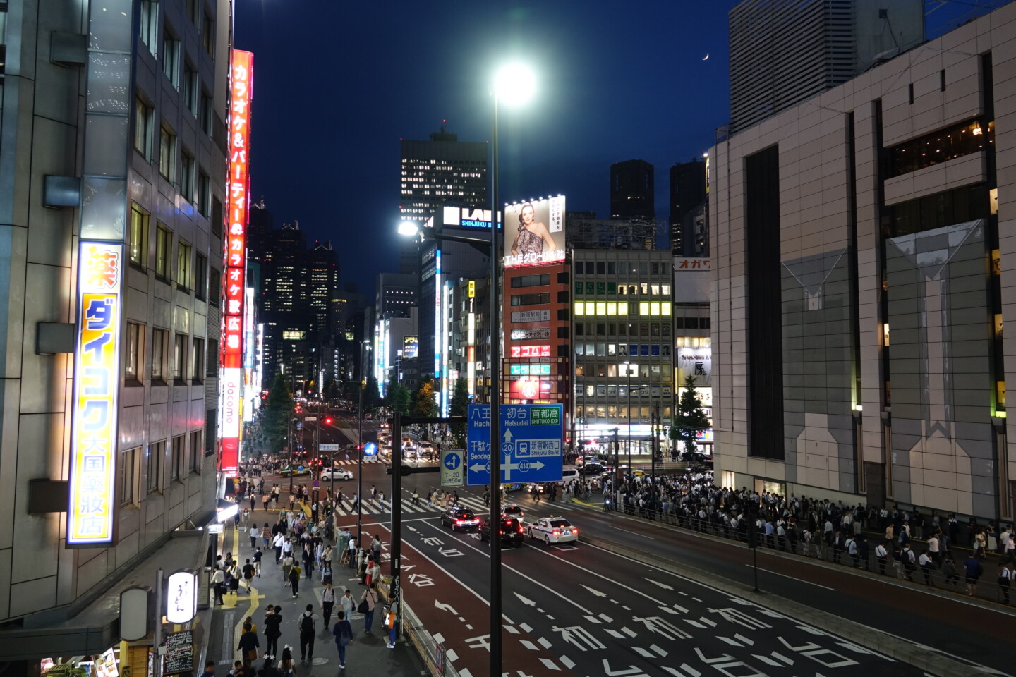 a city street with people walking on it