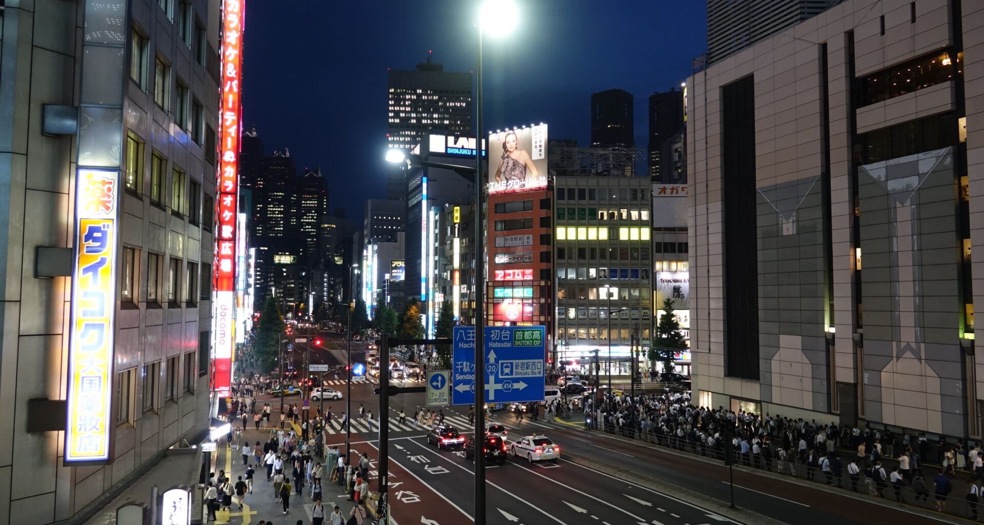 a city street with people walking on it