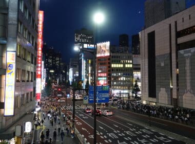 a city street with people walking on it