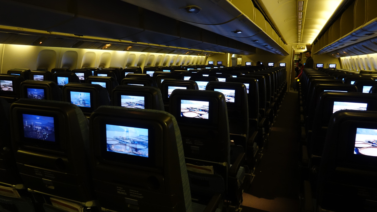 rows of seats with monitors on them