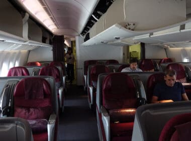 a group of people sitting in an airplane