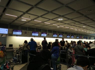 a group of people in a room with monitors