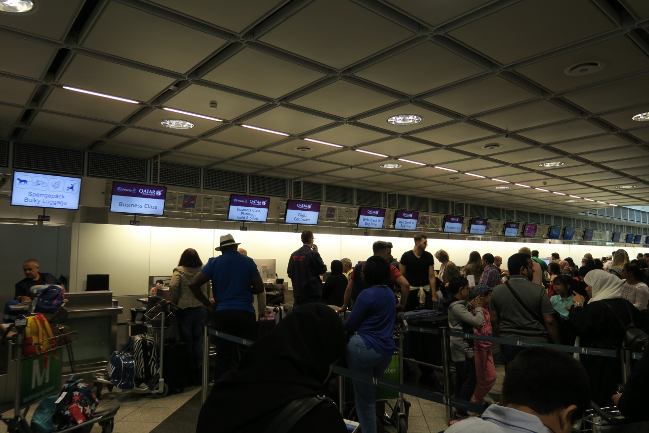 a group of people in a room with monitors