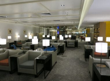 a room with chairs and lamps