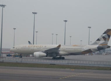 a large white airplane on a runway