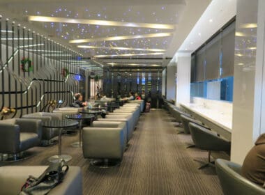 a room with many tables and chairs