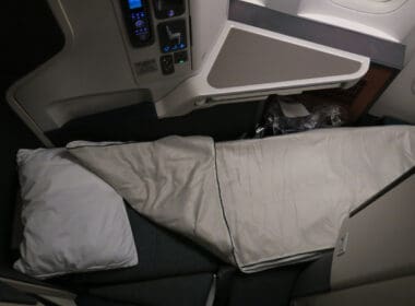 a seat with a pillow on the side