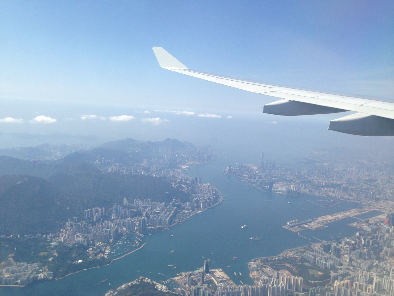 an airplane wing and water in the sky