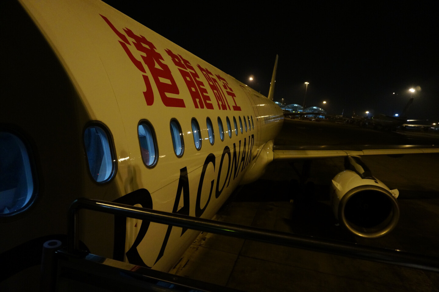 a white airplane with red writing on it