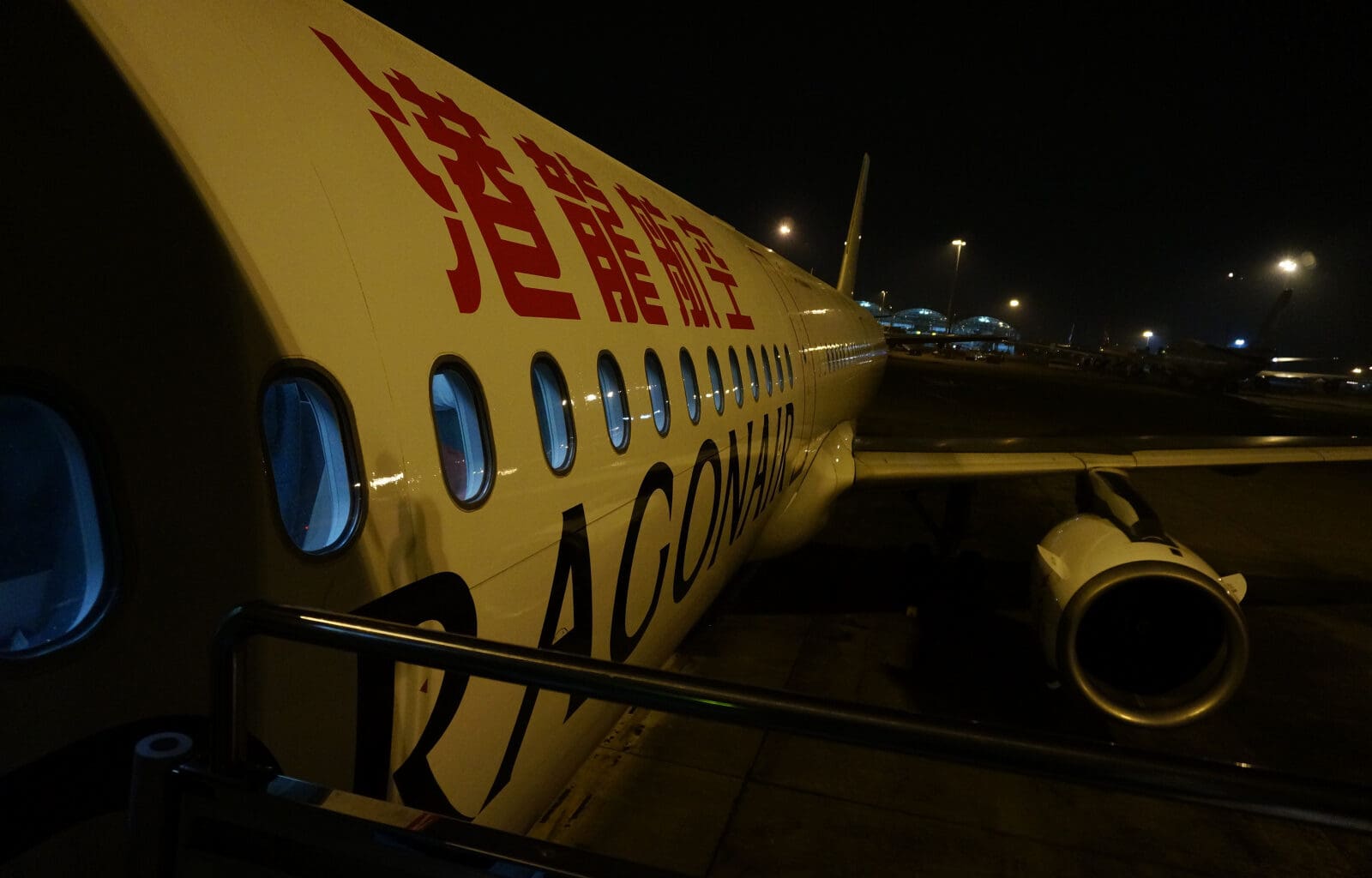 a white airplane with red writing on it