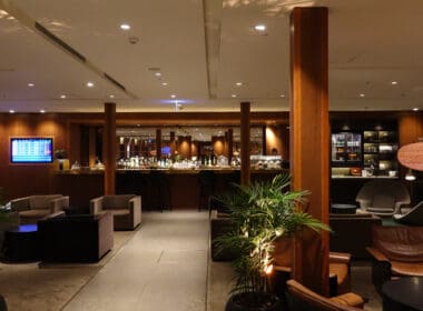 a room with a bar and chairs