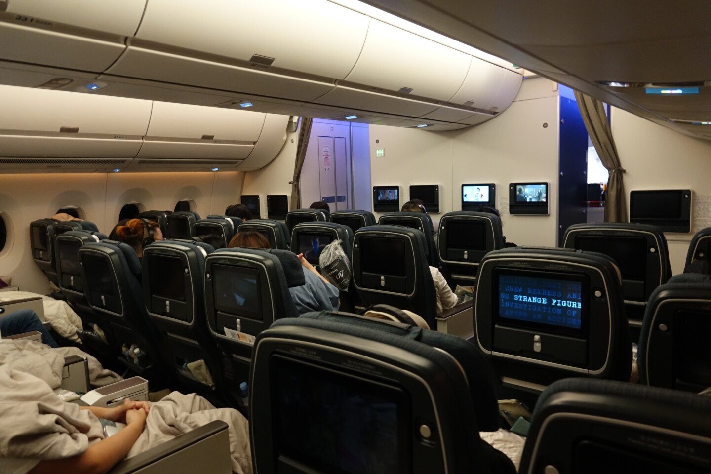 a group of people sitting in an airplane