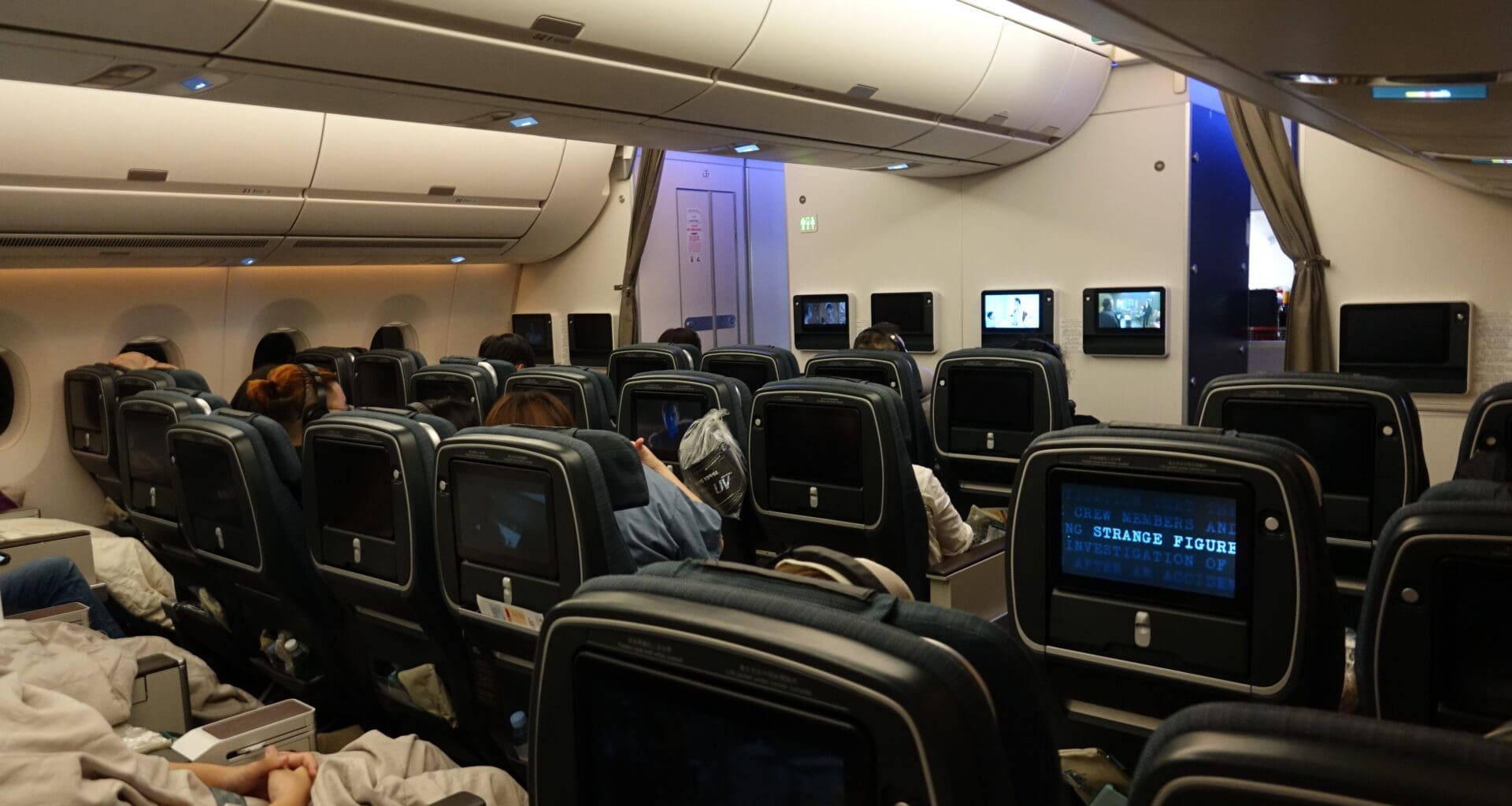 a group of people sitting in an airplane