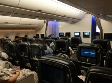 a group of people sitting in an airplane