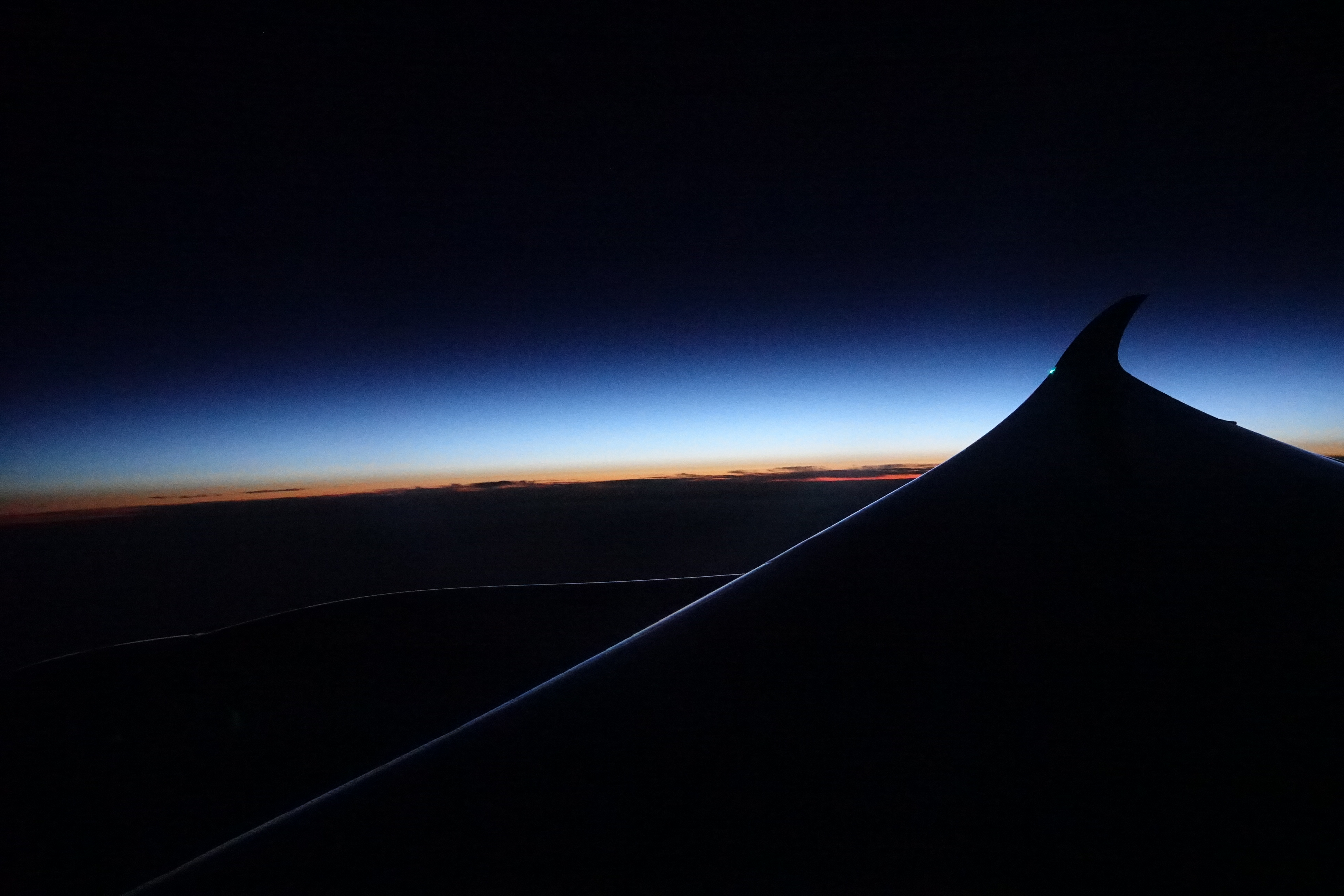 a wing of an airplane at night