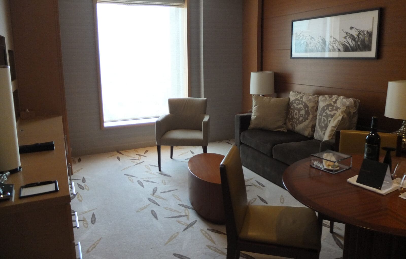 a room with a couch and chairs