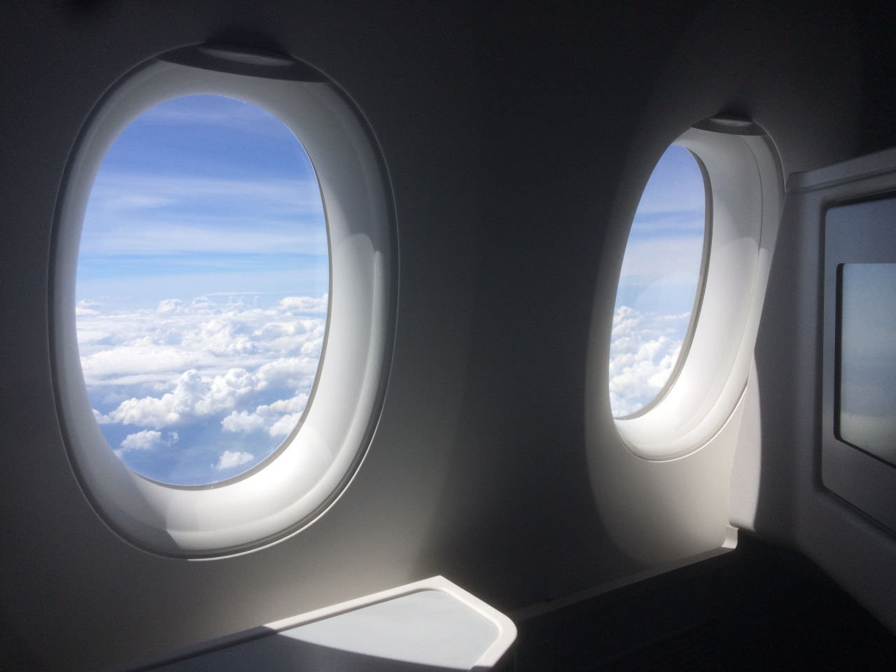 two windows with clouds in the sky