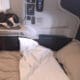 a bed with a pillow and headphones on the side