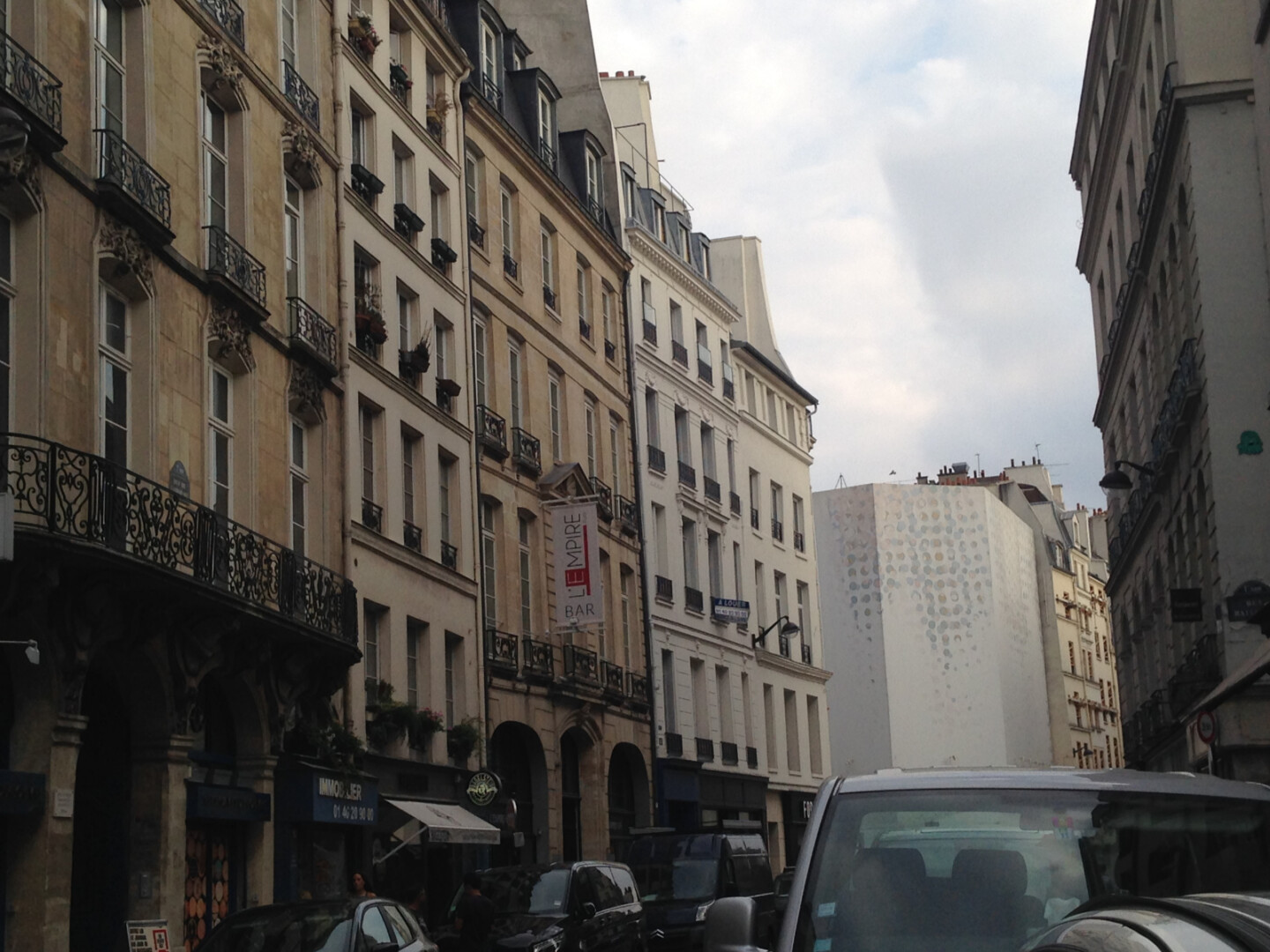 a street with cars and buildings