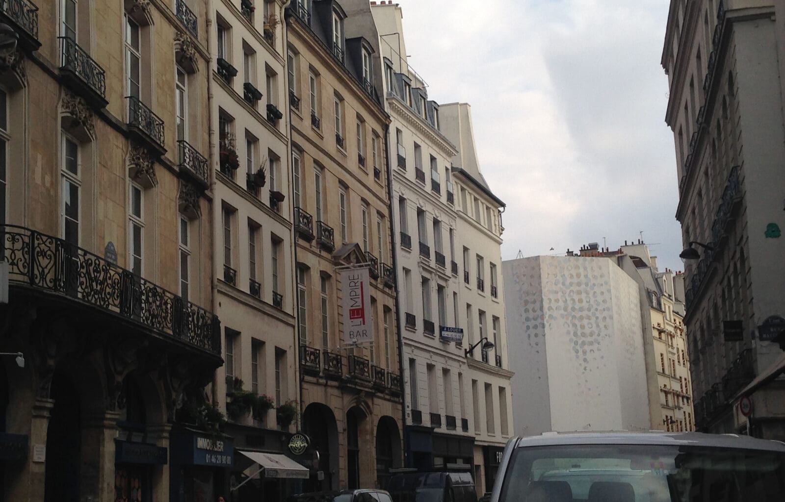 a street with cars and buildings