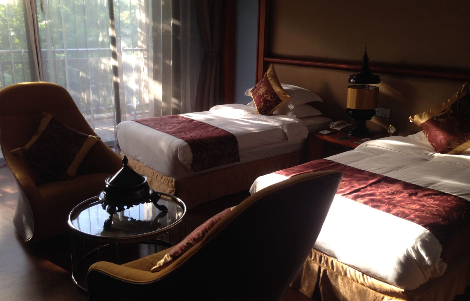 a room with two beds and a table