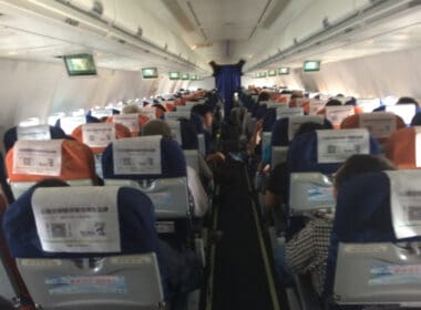 a group of people sitting in an airplane