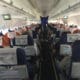 a group of people sitting in an airplane
