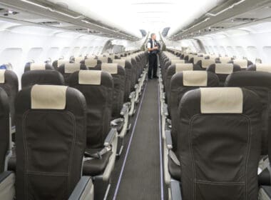 a man standing in an airplane