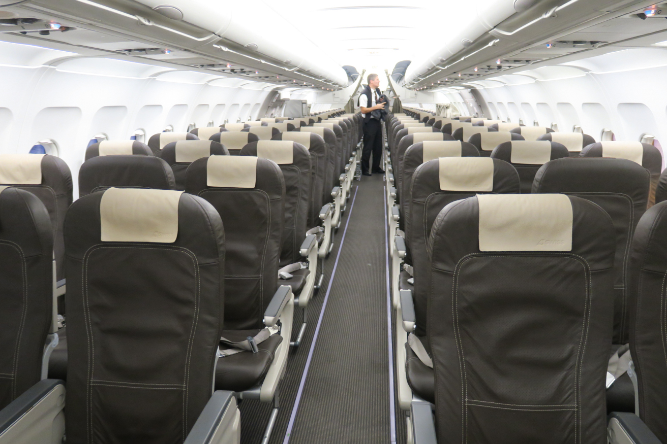 a man standing in an airplane