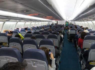 a group of people sitting in an airplane
