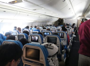 a group of people sitting in an airplane
