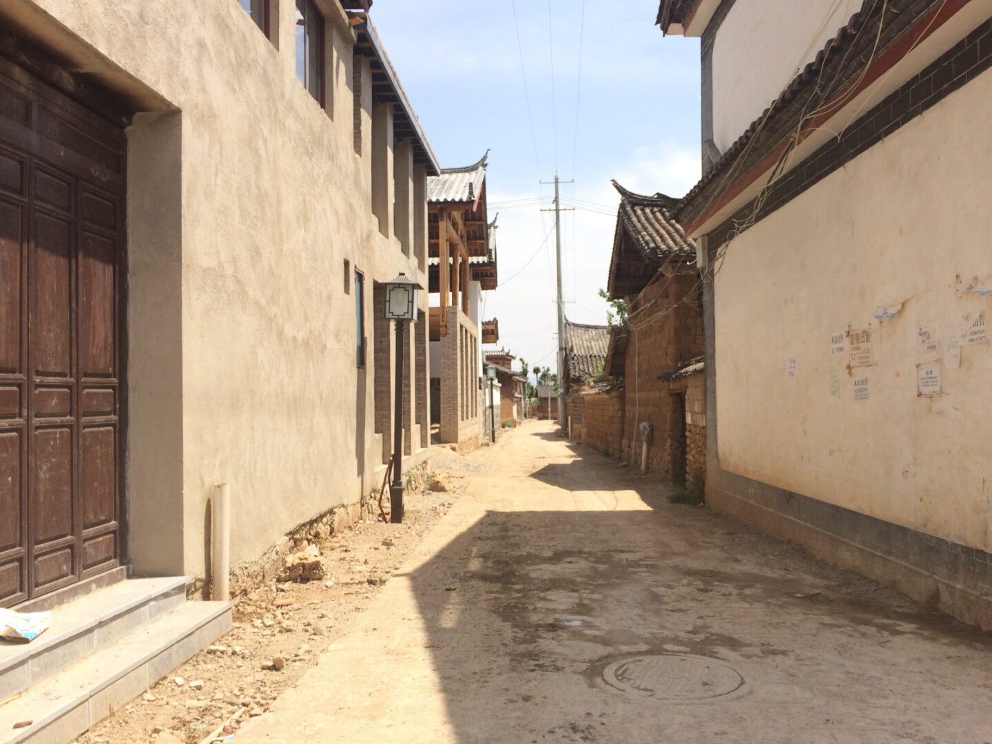 a street with buildings and power lines